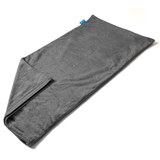 The CooCoCo 12x24 Heating Pad Cover, made of soft gray crystal velvet, is shown laid flat on a white surface with a corner folded to display the inner side and a small blue tag on one edge. (Cover only; replacement accessory.).